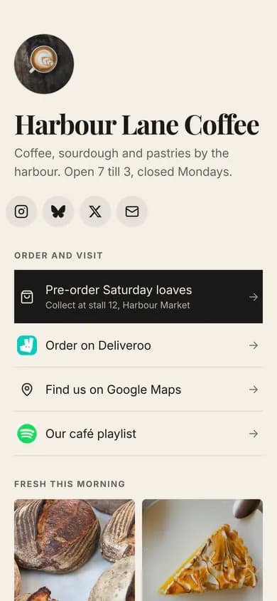 The same café's page in the Editorial theme, with a light background, serif headings and the same links